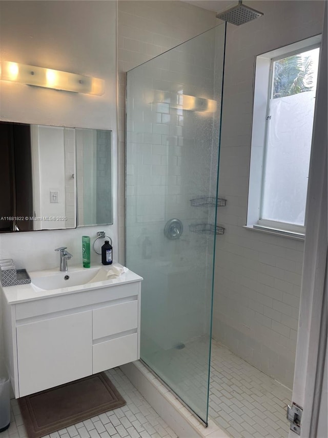 bathroom featuring vanity and a tile shower