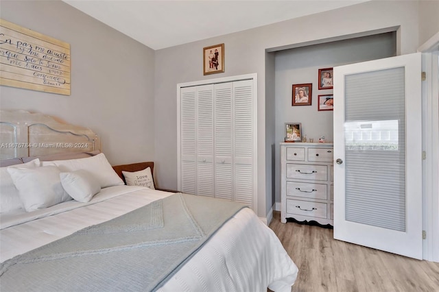 bedroom featuring a closet and light hardwood / wood-style flooring