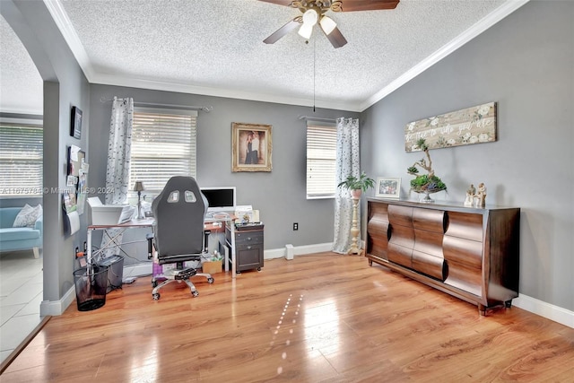 office area featuring ceiling fan, a textured ceiling, plenty of natural light, and hardwood / wood-style floors