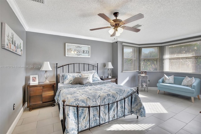 tiled bedroom with ceiling fan, crown molding, and a textured ceiling