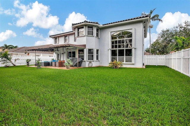 rear view of house featuring a patio, a lawn, and a pergola