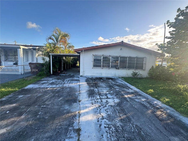 view of front of home featuring a carport