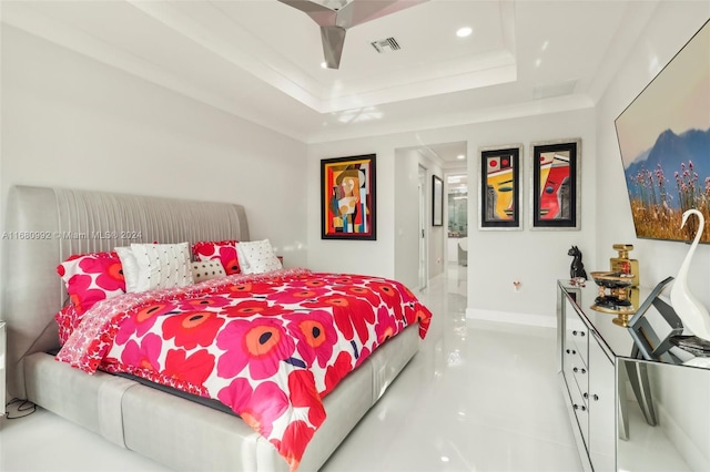 bedroom with connected bathroom and a raised ceiling