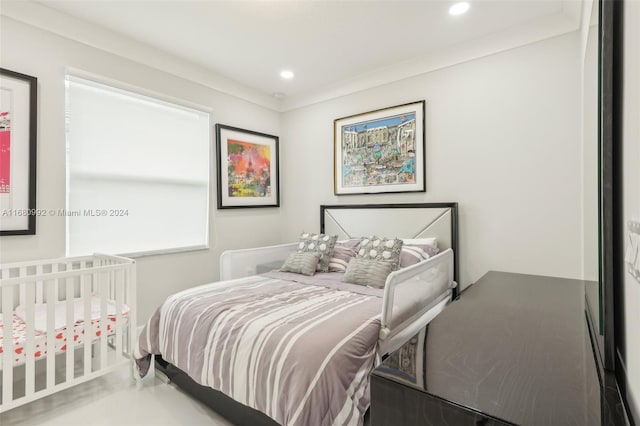 bedroom featuring crown molding