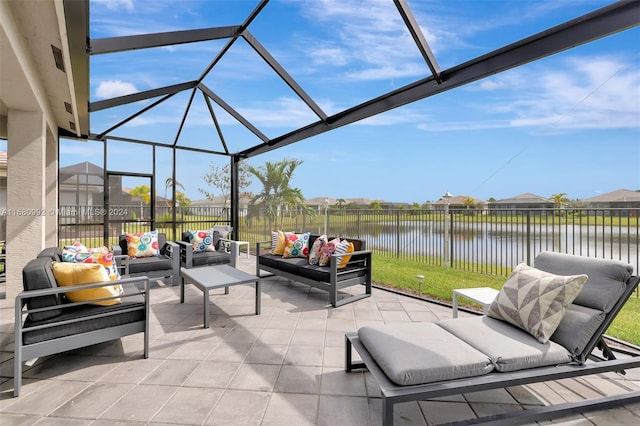 view of patio with outdoor lounge area, a water view, and glass enclosure