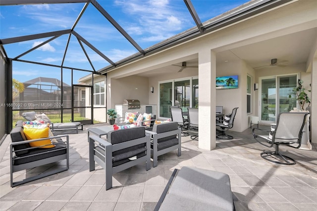 view of patio featuring an outdoor hangout area, area for grilling, glass enclosure, and ceiling fan