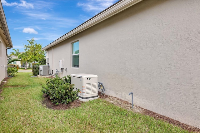 view of side of home featuring a yard