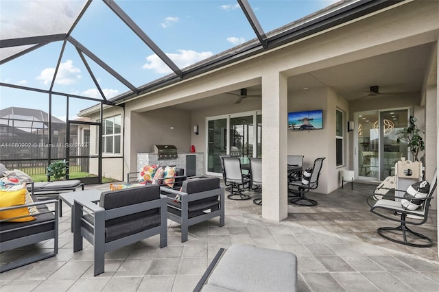 view of patio with a lanai, outdoor lounge area, a grill, and ceiling fan