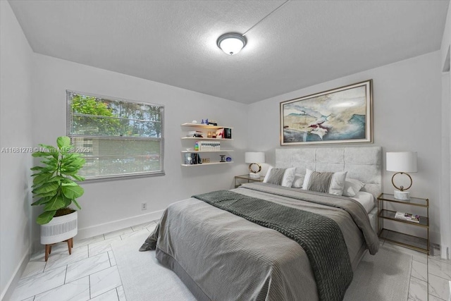 bedroom featuring a textured ceiling