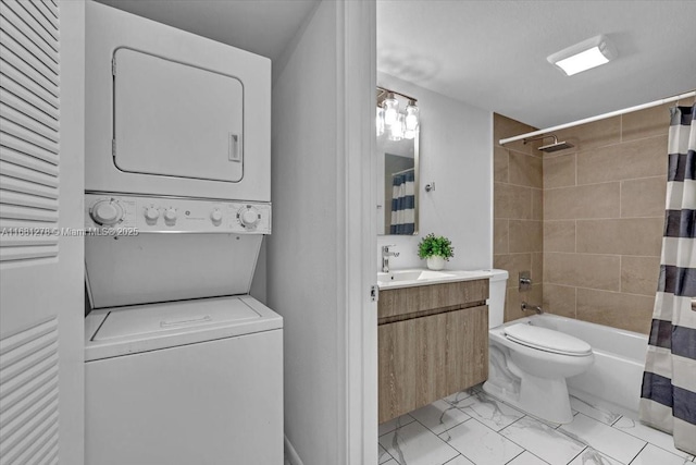 laundry area with stacked washer and clothes dryer and sink