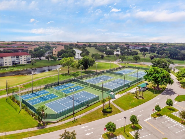 birds eye view of property with a water view