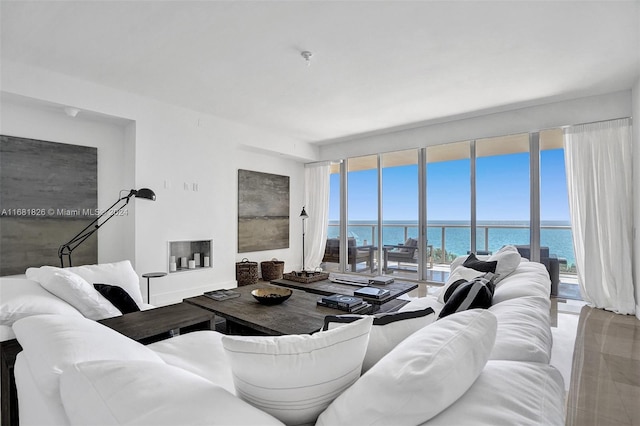 living room with a healthy amount of sunlight and a water view