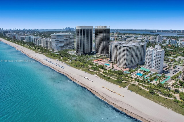 bird's eye view with a water view and a view of the beach