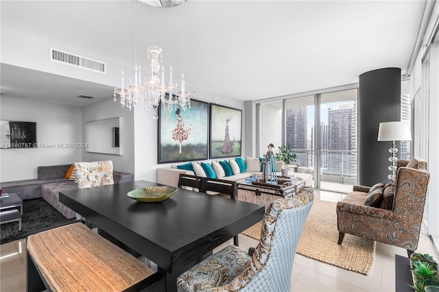 dining room featuring an inviting chandelier and light tile patterned floors