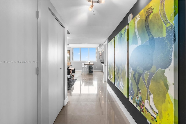 corridor featuring light tile patterned flooring