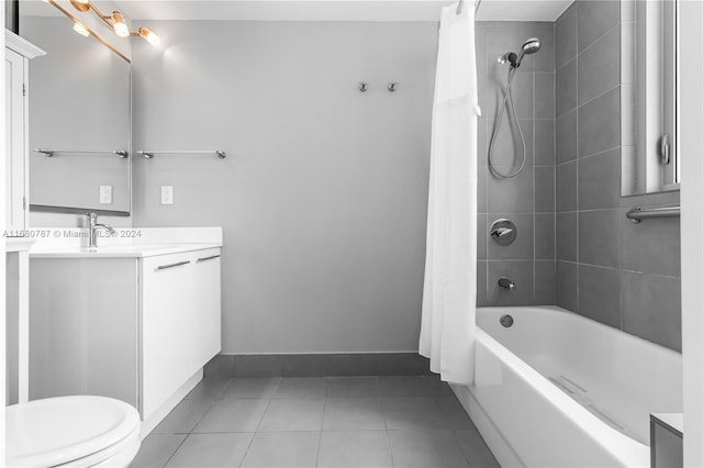 full bathroom featuring vanity, tile patterned flooring, shower / bath combo, and toilet