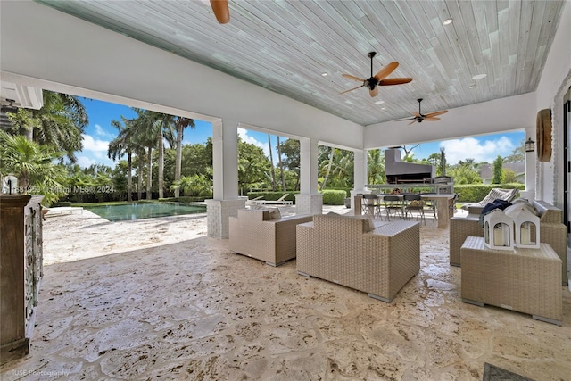 view of patio / terrace featuring a water view, ceiling fan, and outdoor lounge area