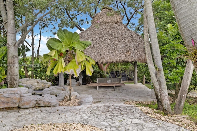 view of property's community featuring a gazebo and a patio area