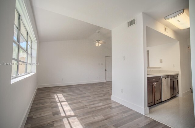 interior space featuring light wood-type flooring, ceiling fan, and lofted ceiling