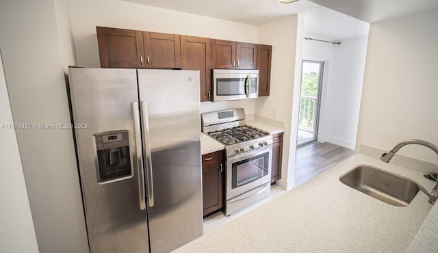 kitchen featuring stainless steel appliances and sink