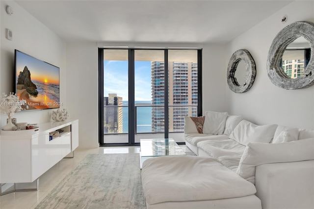 living room with a water view and floor to ceiling windows