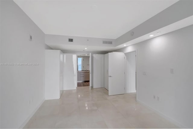 unfurnished room with light tile patterned floors