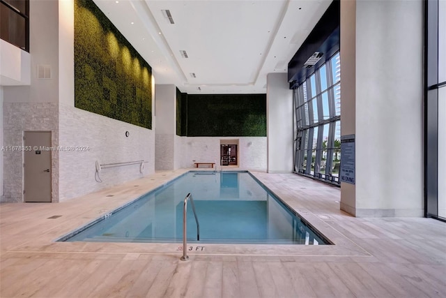 view of pool with a patio area and a jacuzzi