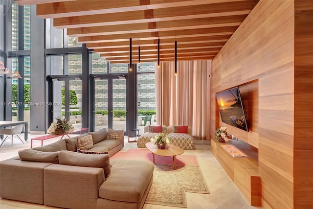 living room featuring french doors and floor to ceiling windows