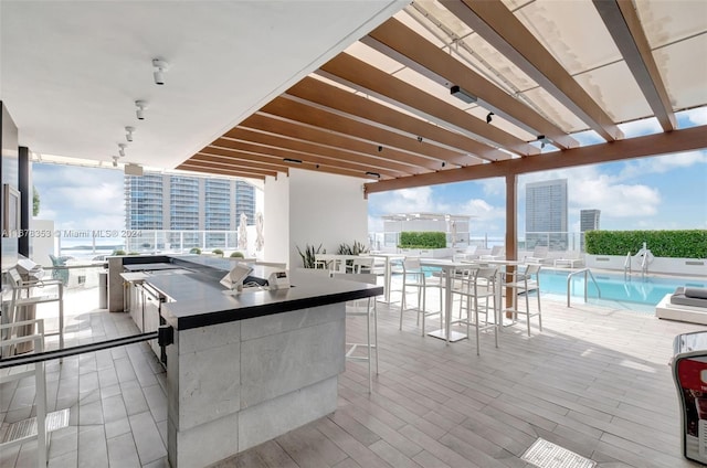 kitchen with expansive windows, a wealth of natural light, and light wood-type flooring