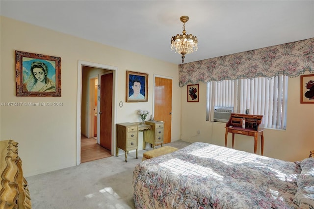 carpeted bedroom with a chandelier