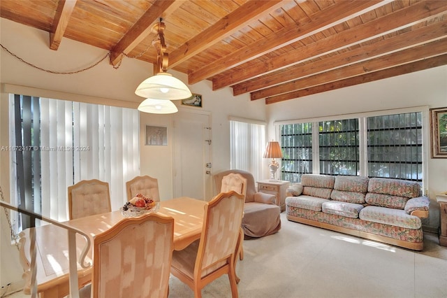 dining area featuring beamed ceiling and wooden ceiling