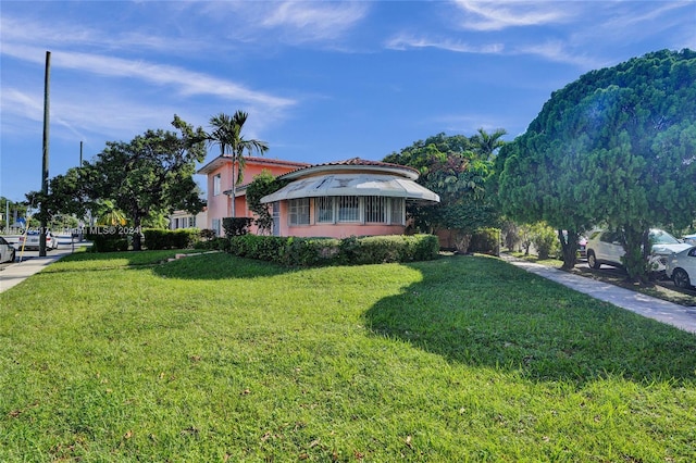 view of front of home with a front yard