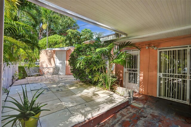 view of patio / terrace with a storage unit