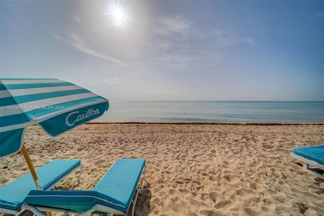 property view of water featuring a beach view