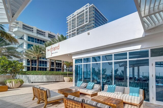 exterior space with an outdoor living space and a balcony