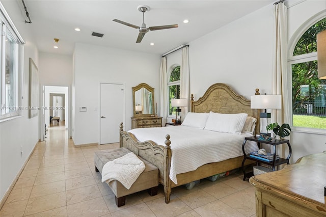 bedroom featuring ceiling fan and light tile patterned flooring