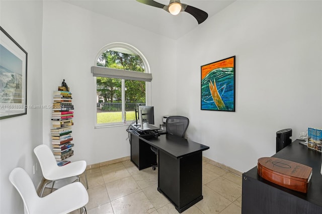 tiled office space with ceiling fan