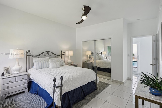 tiled bedroom with a closet and ceiling fan