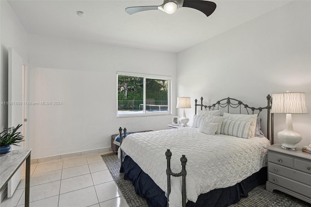 bedroom with light tile patterned floors and ceiling fan