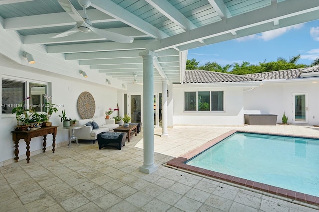 view of swimming pool with a patio area, an outdoor living space, and ceiling fan