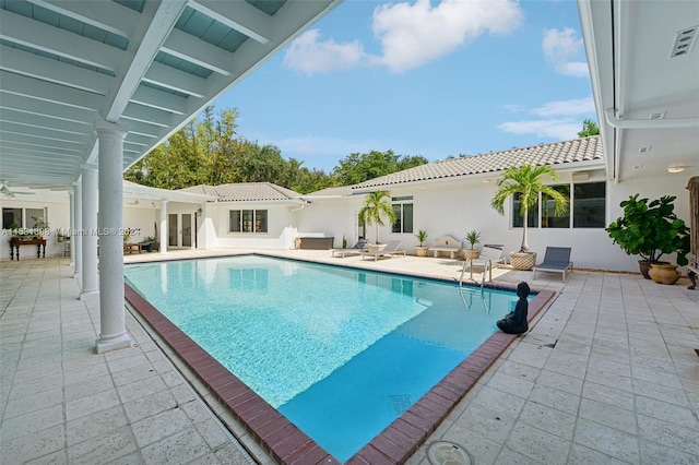 view of swimming pool featuring a patio area