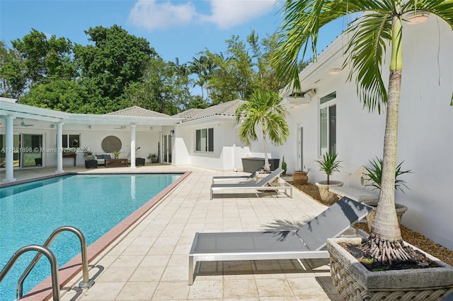 view of swimming pool with a patio area