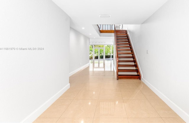 hallway featuring light tile patterned floors