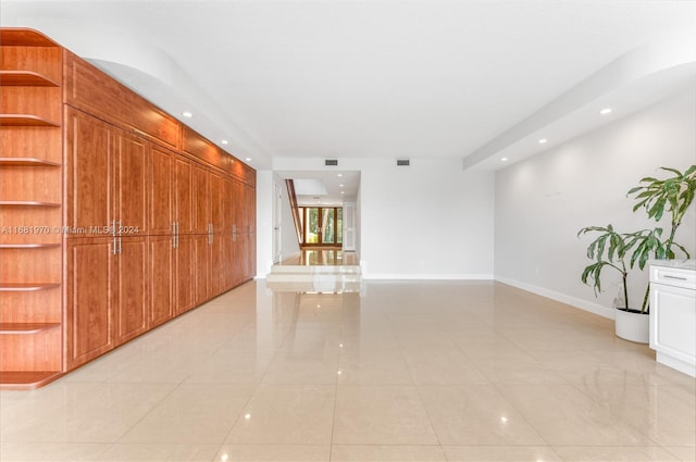 spare room featuring light tile patterned floors