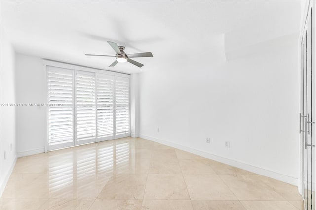 spare room with ceiling fan