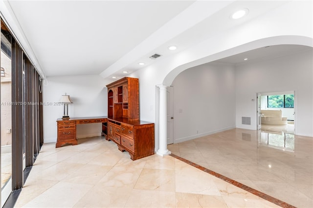 corridor featuring decorative columns