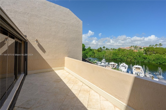 balcony featuring a water view