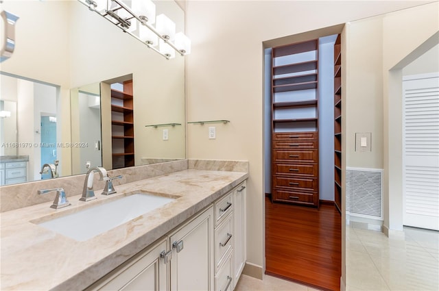 bathroom featuring vanity and hardwood / wood-style flooring