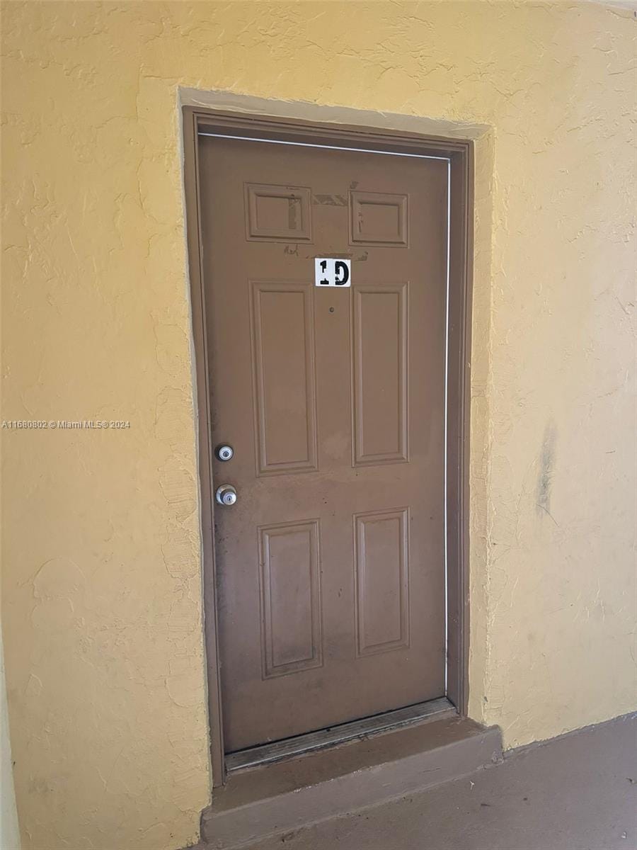 2814 NW 55th Ave Unit 1D, Lauderhill, FL 33313 - view of exterior entry featuring stucco siding