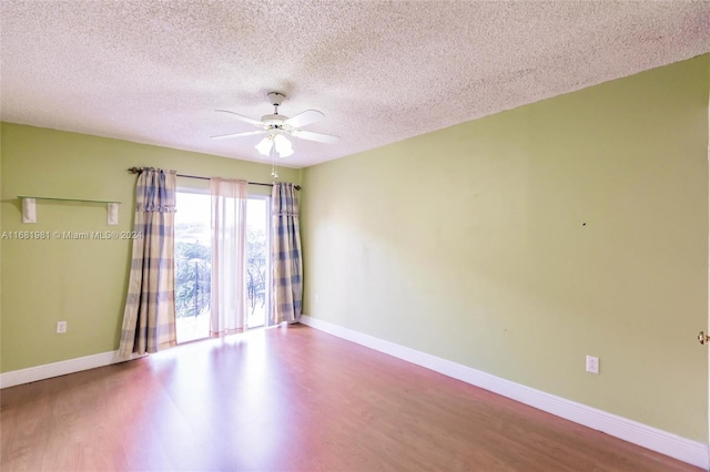 unfurnished room featuring ceiling fan, a textured ceiling, and hardwood / wood-style floors